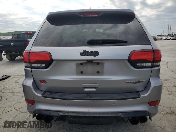 2018 Jeep Grand Cherokee Trackhawk with VIN 1C4RJFN91JC223825, listed as a Copart auction lot 58011465 with 83,177 mi miles and Salvage title. Bid and sale history available at DreamBid. Image 6.