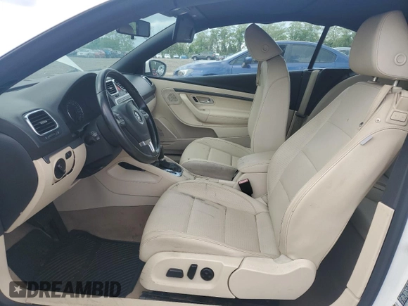 2011 Volkswagen Eos Komfort with VIN WVWBW7AH2BV003170, listed as a Copart auction lot 55771285 with 129,847 mi miles and Salvage Title. Bid and sale history available at DreamBid. Image 7.