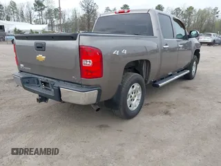 2013 Chevrolet Silverado 1500 LT with VIN 3GCPKSE74DG332907, listed as a IAAI auction lot 41951755 with 214,211 mi miles. Bid and sale history available at carsss.com. Image 4.