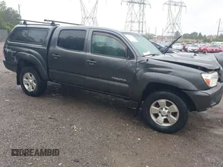 2014 Toyota Tacoma with VIN 3TMLU4EN1EM145758, listed as a IAAI auction lot 42320358 with 129,905 mi miles and . Bid and sale history available at DreamBid. Image 1.