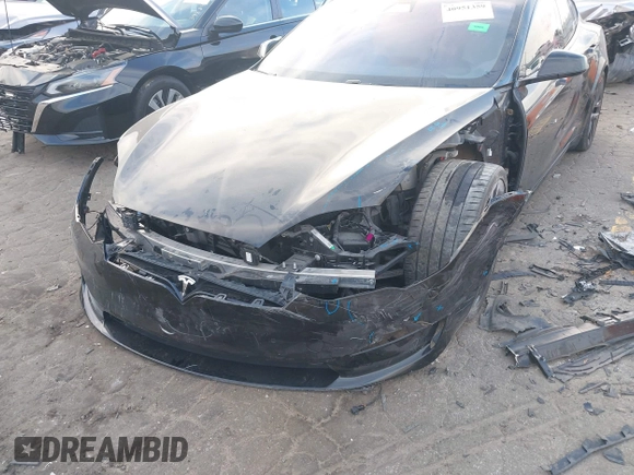 2022 Tesla Model S Plaid with VIN 5YJSA1E6XNF460235, listed as a IAAI auction lot 40951359 with 18,922 mi miles and . Bid and sale history available at DreamBid. Image 6.