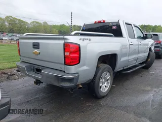 2018 Chevrolet Silverado 1500 LT with VIN 1GCVKREC7JZ151678, listed as a IAAI auction lot 41972011 with 106,892 mi miles and . Bid and sale history available at DreamBid. Image 4.