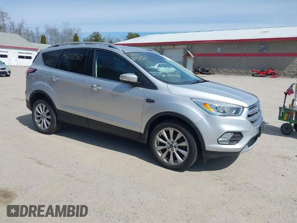2017 Ford Escape Titanium with VIN 1FMCU9JD3HUE03686, listed as a IAAI auction lot 42016950 with 82,299 mi miles. Bid and sale history available at carsss.com. Image 1.