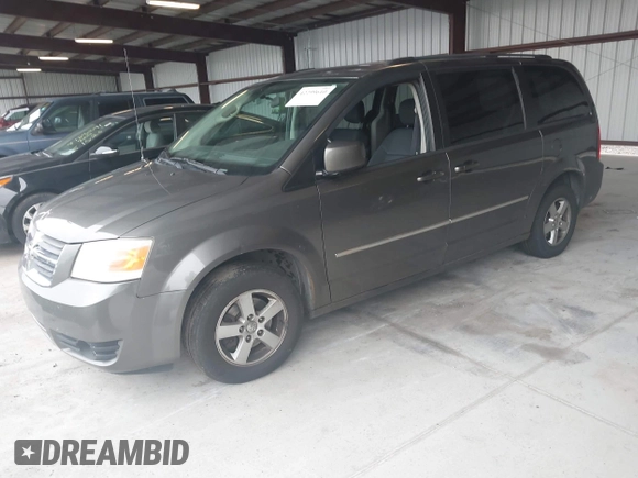 2010 Dodge Grand Caravan SXT z VIN 2D4RN5D11AR220105, wystawiony jako IAAI lot #42299610 z przebiegiem 223 842 mil mil oraz . Historia ofert i sprzedaży dostępna na DreamBid. Obrazek 2.