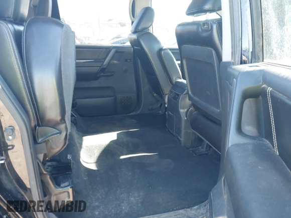 2014 Nissan Titan S with VIN 1N6AA0EC6EN506928, listed as a IAAI auction lot 41380319 with 102,669 mi miles and . Bid and sale history available at DreamBid. Image 8.