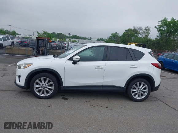 2015 Mazda CX-5 Grand Touring with VIN JM3KE4DY5F0530854, listed as a IAAI auction lot 42274582 with 144,732 mi miles and . Bid and sale history available at DreamBid. Image 14.