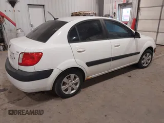 2009 Kia Rio SX with VIN KNADE223896533839, listed as a IAAI auction lot 41328220 with 140,968 mi miles. Bid and sale history available at carsss.com. Image 4.