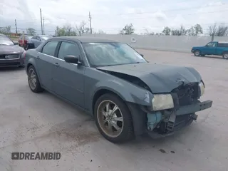 2006 Chrysler 300 with VIN 2C3KA43R56H217771, listed as a IAAI auction lot 41859397 with 154,227 mi miles. Bid and sale history available at carsss.com. Image 1.