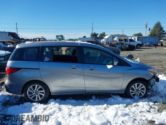 2014 Mazda 5 Sport with VIN JM1CW2BLXE0168119, listed as a IAAI auction lot 41527688 with 142,357 mi miles and . Bid and sale history available at DreamBid. Image 13.