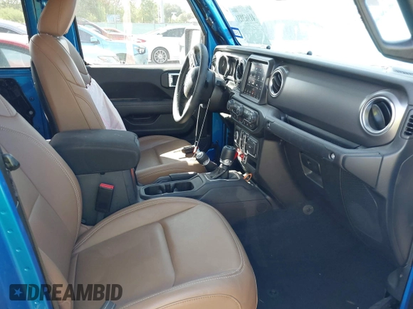2023 Jeep Gladiator Rubicon with VIN 1C6JJTBG3PL581023, listed as a IAAI auction lot 41963931 with 15,023 mi miles and . Bid and sale history available at DreamBid. Image 5.