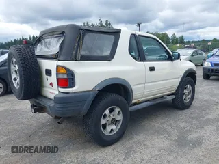 1998 Isuzu Rodeo with VIN 4S2CM57W9W4373049, listed as a IAAI auction lot 42599157 with 140,368 mi miles and . Bid and sale history available at DreamBid. Image 4.