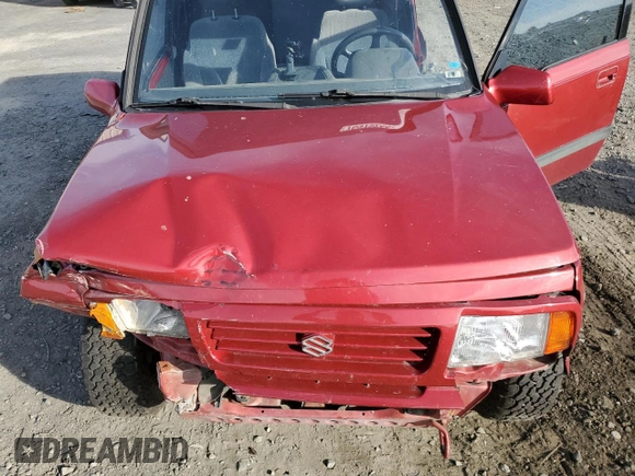 1995 Suzuki Sidekick z VIN JS3TD03V6S4113425, wystawiony jako Copart lot #76973244 z przebiegiem 152 638 mil mil oraz Szkody całkowita. Historia ofert i sprzedaży dostępna na DreamBid. Obrazek 11.
