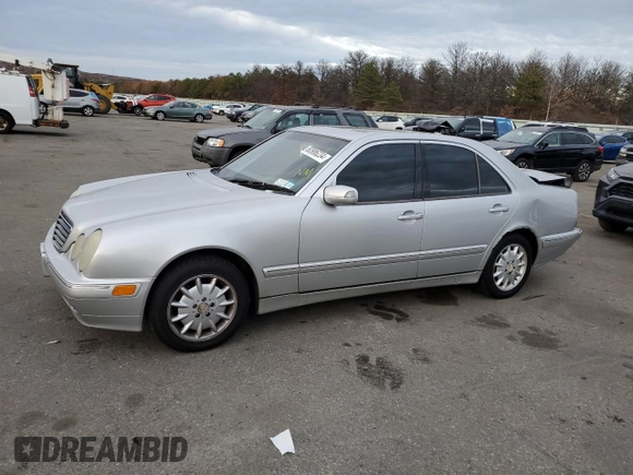 2000 Mercedes-Benz E-Class with VIN WDBJF65J8YB153103, listed as a Copart auction lot 80986234 with 144,205 mi miles and Salvage Title. Bid and sale history available at carsss.com. Image 1.