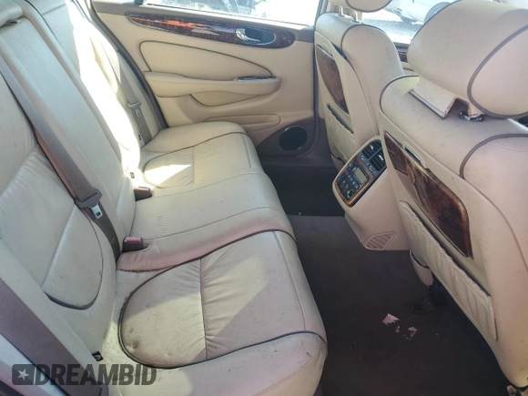 2005 Jaguar XJ Vanden Plas z VIN SAJWA82C75SG33074, wystawiony jako Copart lot #48725755 z przebiegiem 129 817 mil mil oraz Czysty tytuł • Clean title. Historia ofert i sprzedaży dostępna na DreamBid. Obrazek 10.