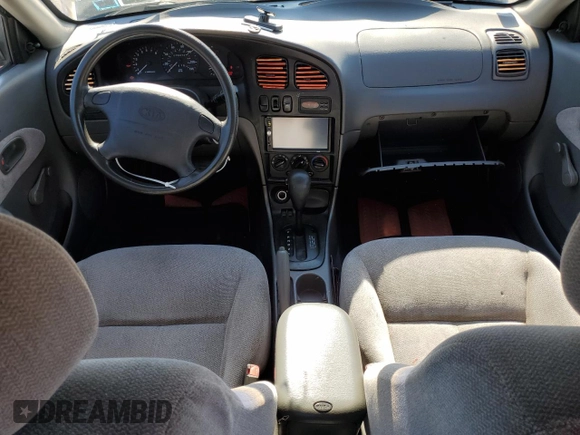 2001 Kia Spectra GS z VIN KNAFB161115036033, wystawiony jako Copart lot #55939335 z przebiegiem 76 414 mil mil oraz Szkoda całkowita • Salvage title. Historia ofert i sprzedaży dostępna na DreamBid. Obrazek 8.
