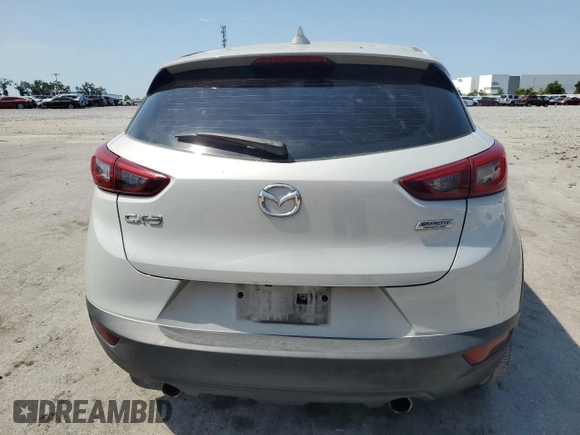 2017 Mazda CX-3 Touring z VIN JM1DKDC75H0168823, wystawiony jako Copart lot #57968955 z przebiegiem 116 231 mil mil oraz Szkoda całkowita • Salvage title. Historia ofert i sprzedaży dostępna na DreamBid. Obrazek 6.