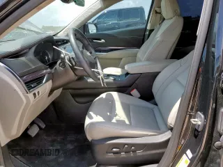 2023 Cadillac XT4 FWD Luxury with VIN 1GYAZAR46PF178003, listed as a Copart auction lot 59121545 with 42,000 mi miles and Salvage title. Bid and sale history available at DreamBid. Image 7.