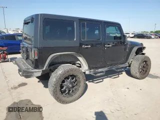 2013 Jeep Wrangler Unlimited Freedom z VIN 1C4BJWDG0DL513902, wystawiony jako Copart lot #52045975 z przebiegiem 166 827 mil mil oraz Szkoda całkowita • Salvage title. Historia ofert i sprzedaży dostępna na DreamBid. Obrazek 3.