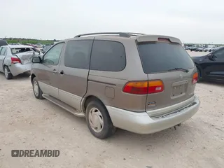1999 Toyota Sienna LE with VIN 4T3ZF13C5XU164075, listed as a IAAI auction lot 42063741 with 93,407 mi miles. Bid and sale history available at carsss.com. Image 3.
