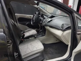 2013 Ford Fiesta SE with VIN 3FADP4EJ1DM107945, listed as a IAAI auction lot 42025064 with Not Provided miles and . Bid and sale history available at DreamBid. Image 5.