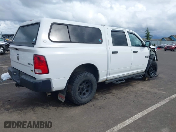 2014 Ram 1500 Tradesman with VIN 1C6RR7KG4ES323888, listed as a IAAI auction lot 41975474 with 93,779 mi miles and . Bid and sale history available at DreamBid. Image 4.
