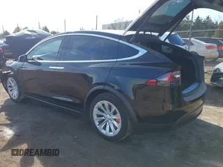 2018 Tesla Model X 75D with VIN 5YJXCDE44JF091690, listed as a IAAI auction lot 41585617 with 128,826 mi miles and . Bid and sale history available at DreamBid. Image 3.
