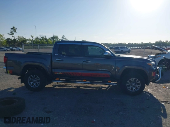 2018 Toyota Tacoma SR5 with VIN 3TMAZ5CN4JM069965, listed as a IAAI auction lot 41798238 with 124,619 mi miles and . Bid and sale history available at DreamBid. Image 14.