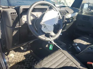 2005 Jeep Wrangler SE with VIN 1J4FA29S65P330905, listed as a Copart auction lot 71633134 with 77,598 mi miles and Salvage Title. Bid and sale history available at carsss.com. Image 8.
