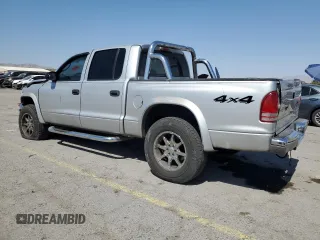 2004 Dodge Dakota SLT with VIN 1D7HG48N74S509797, listed as a Copart auction lot 57797055 with 214,275 mi miles and Salvage title. Bid and sale history available at DreamBid. Image 2.