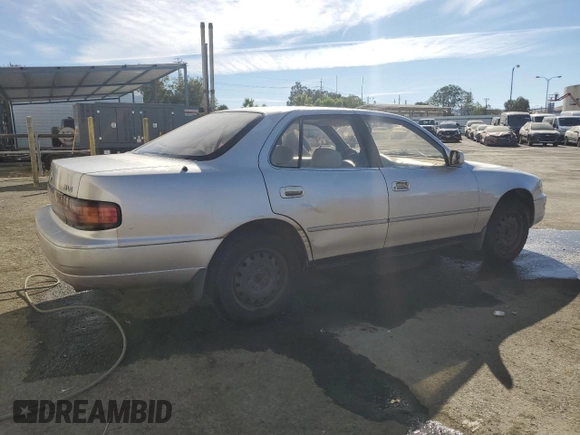 1994 Toyota Camry LE z VIN JT2GK12EXR0070117, wystawiony jako Copart lot #75997244 z przebiegiem 185 759 mil mil oraz Czysty tytuł • Clean title. Historia ofert i sprzedaży dostępna na DreamBid. Obrazek 3.