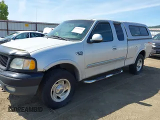1999 Ford F-150 XL with VIN 2FTRX18LXXCA77730, listed as a IAAI auction lot 42181915 with 240,164 mi miles and . Bid and sale history available at DreamBid. Image 2.