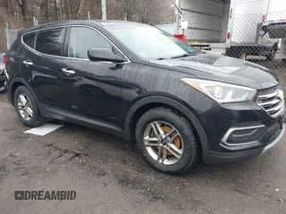 2018 Hyundai Santa Fe 2.4L z VIN 5XYZTDLB6JG556859, wystawiony jako IAAI lot #41722694 z przebiegiem 120 663 mil mil oraz . Historia ofert i sprzedaży dostępna na DreamBid. Obrazek 1.