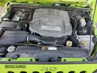 2013 Jeep Wrangler Rubicon 10th Anniversary with VIN 1C4BJWCG0DL506174, listed as a Copart auction lot 85300514 with 133,974 mi miles and Salvage Title. Bid and sale history available at DreamBid. Image 12.