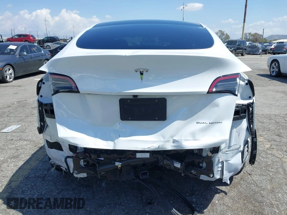 2023 Tesla Model Y Long Range with VIN 7SAYGAEE5PF855834, listed as a IAAI auction lot 41943491 with 34,480 mi miles. Bid and sale history available at carsss.com. Image 6.