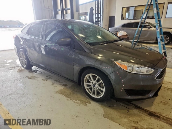 2018 Ford Focus SE with VIN 1FADP3FE0JL311760, listed as a Copart auction lot 63621755 with 81,000 mi miles and Salvage title. Bid and sale history available at DreamBid. Image 4.