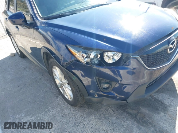 2014 Mazda CX-5 Grand Touring with VIN JM3KE2DY7E0376389, listed as a IAAI auction lot 42014946 with 126,081 mi miles. Bid and sale history available at carsss.com. Image 6.