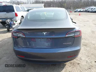 2018 Tesla Model 3 Long Range Battery with VIN 5YJ3E1EB5JF063077, listed as a IAAI auction lot 41773551 with 99,477 mi miles and . Bid and sale history available at DreamBid. Image 16.