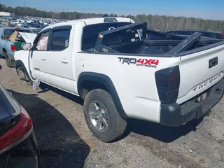 2018 Toyota Tacoma SR with VIN 5TFCZ5AN6JX144056, listed as a IAAI auction lot 41623760 with Not Provided miles and . Bid and sale history available at DreamBid. Image 3.