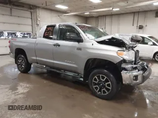 2014 Toyota Tundra 4WD Truck SR with VIN 5TFUY5F17EX357035, listed as a IAAI auction lot 39928076 with 129,831 mi miles. Bid and sale history available at carsss.com. Image 1.