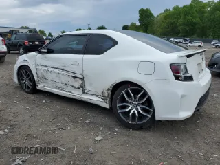 2014 Scion tC z VIN JTKJF5C70E3084411, wystawiony jako Copart lot #54255385 z przebiegiem 152 715 mil mil oraz Szkody całkowita. Historia ofert i sprzedaży dostępna na DreamBid. Obrazek 2.