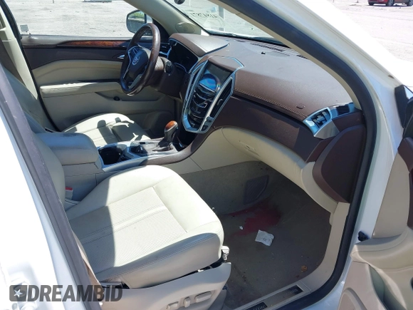 2016 Cadillac SRX Luxury Collection z VIN 3GYFNEE34GS513728, wystawiony jako IAAI lot #41847871 z przebiegiem 109 045 mil mil oraz . Historia ofert i sprzedaży dostępna na DreamBid. Obrazek 5.