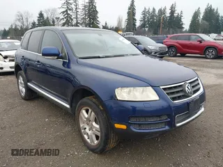 2005 Volkswagen Touareg 4.2L V8 with VIN WVGZM77L05D076639, listed as a IAAI auction lot 41288233 with 148,954 mi miles and . Bid and sale history available at DreamBid. Image 1.