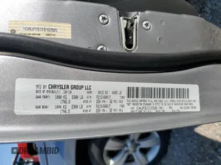2015 Jeep Patriot Latitude with VIN 1C4NJPFB1FD157025, listed as a Copart auction lot 52310155 with 132,752 mi miles and Salvage title. Bid and sale history available at DreamBid. Image 13.