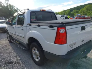 2003 Ford Explorer Sport Trac XLS z VIN 1FMZU77E33UA26042, wystawiony jako IAAI lot #42524905 z przebiegiem 124 878 mil mil oraz . Historia ofert i sprzedaży dostępna na DreamBid. Obrazek 3.