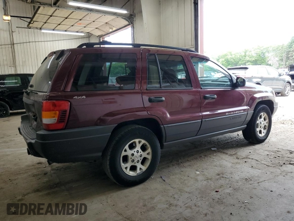 2001 Jeep Grand Cherokee Laredo z VIN 1J4GW48S11C609344, wystawiony jako Copart lot #59258245 z przebiegiem 162 141 mil mil oraz Szkoda całkowita • Salvage title. Historia ofert i sprzedaży dostępna na DreamBid. Obrazek 3.