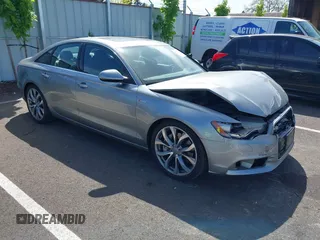 2014 Audi A6 Premium Plus z VIN WAUFGAFC1EN086035, wystawiony jako IAAI lot #42121646 z przebiegiem 119 099 mil mil oraz . Historia ofert i sprzedaży dostępna na DreamBid. Obrazek 1.