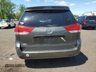 2012 Toyota Sienna with VIN 5TDZK3DC8CS198495, listed as a Copart auction lot 57335205 with 66,786 mi miles and Salvage title. Bid and sale history available at DreamBid. Image 6.
