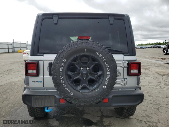 2023 Jeep Wrangler 4xe with VIN 1C4JJXN69PW703790, listed as a Copart auction lot 51190985 with 35,504 mi miles and Salvage Title. Bid and sale history available at carsss.com. Image 6.