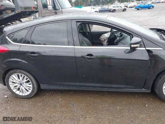 2015 Ford Focus Titanium with VIN 1FADP3N2XFL300859, listed as a IAAI auction lot 41944410 with 76,194 mi miles. Bid and sale history available at carsss.com. Image 14.
