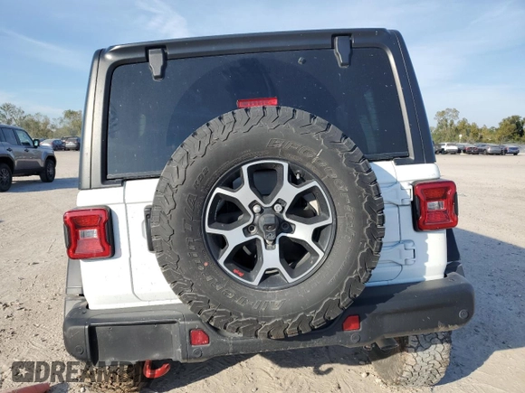 2022 Jeep Wrangler Unlimited Rubicon с VIN 1C4HJXFN3NW193177, выставлен на аукционе Copart как лот 82002224 с пробегом 34 762 миль миль и Списание • Salvage title. История ставок и продаж доступна на DreamBid. Изображение 6.